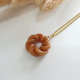 Translucent Brilliant Orange Jadeite “Eternity Knot” Pendant (JAB004994)